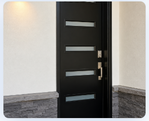 Modern black entry door with stone surround