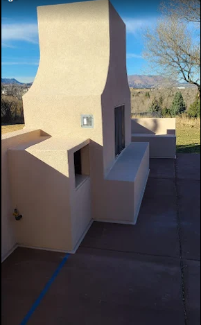 Custom stucco outdoor fireplace