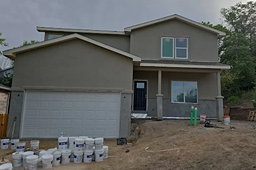 Two-story stucco home in progress